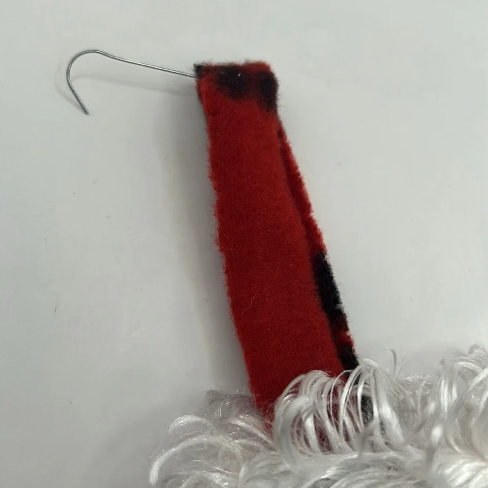 Red Christmas Stocking with Black Paw Prints.